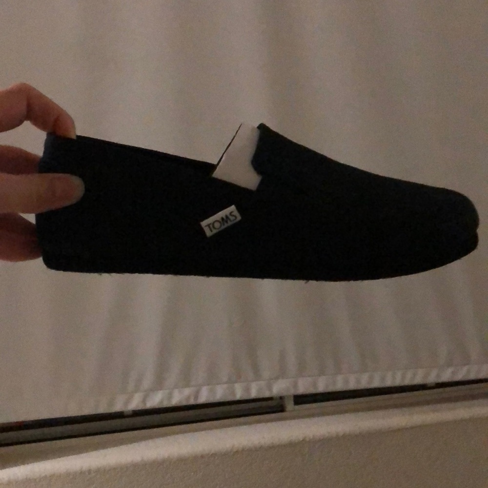 Toms black slip on shoes. BRAND NEW